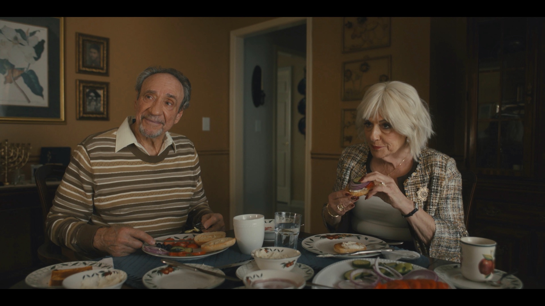Saul and Miriam sharing a meal at their dining table